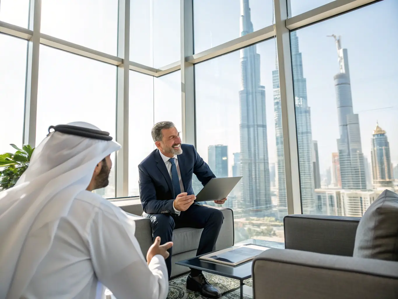 A professional meeting between an agent and a client discussing property investment opportunities with Dubai skyline in the background, representing Gursaya Real Estate's investment advisory service.